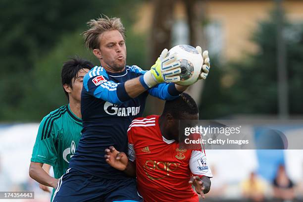 Timo Hildebrand of Schalke and Emmanuel Mayuka of Southampton fight for the ball during the preseason friendly match between FC Southampton and FC...