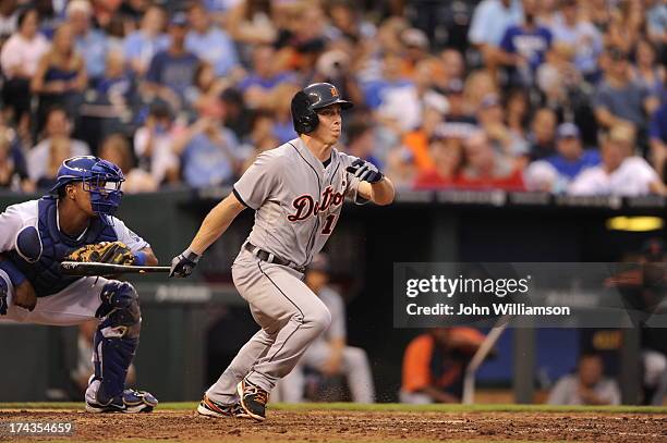 Andy Dirks of the Detroit Tigers bats and runs to first base from the batter's box in the game against the Kansas City Royals on July 20, 2013 at...