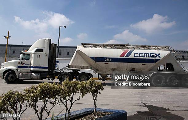 Truck waits outside Cemex SAB's Anahuac cement plant in Barrientos in the state of Mexico on Wednesday, July 24, 2013. Mexican President Enrique Pena...