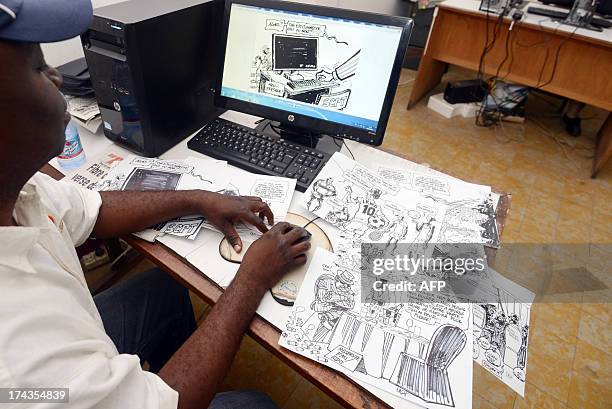 Congolese cartoonist for daily newspaper the Potentiel, Kashoun Thembo, also known as Kash, works at his office on July 18, 2013 in Kinshasa. The...