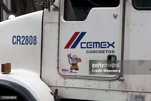 The logo for Cemex SAB is displayed on a truck at a construction site in Mexico City, Mexico. On Friday, July 19, 2013. Mexican President Enrique...