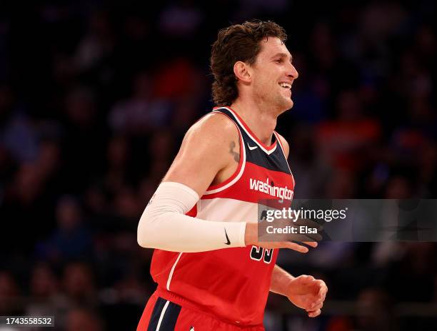 Mike Muscala of the Washington Wizards celebrates his three point shot in the first half against the New York Knicks during a preseason game at...