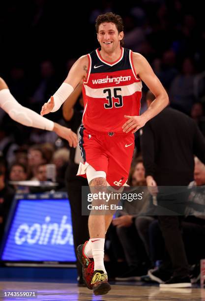 Mike Muscala of the Washington Wizards celebrates his three point shot in the first half against the New York Knicks during a preseason game at...