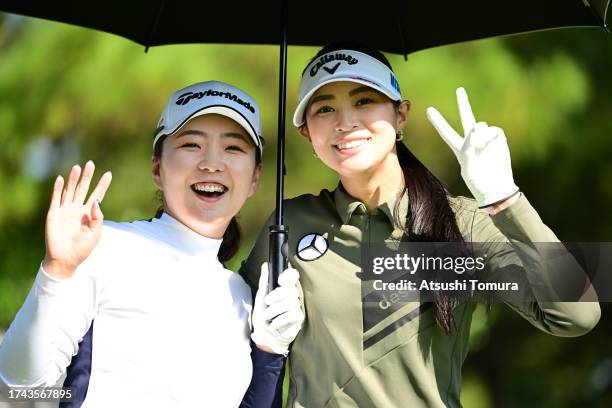 Hinako Yamauchi and Asuka Kashiwabara of Japan pose on the 13th hole during the first round of NOBUTA Group Masters GC Ladies at Masters Golf Club on...