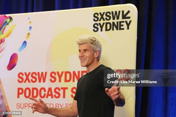 Osher Gunsberg introduces Peter Garrett during the 'Better Than Yesterday' session at SXSW Sydney on October 19, 2023 in Sydney, Australia.