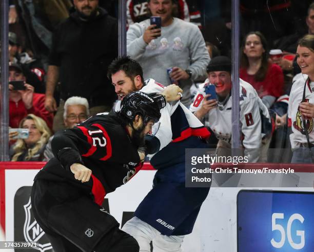 Tom Wilson of the Washington Capitals and Mark Kastelic of the Ottawa Senators fight in the second period at Canadian Tire Centre on October 18, 2023...