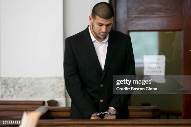 Aaron Hernandez stood in the court room. Former New England Patriots tight end Aaron Hernandez appeared in Attleboro District Court in Attleboro,...