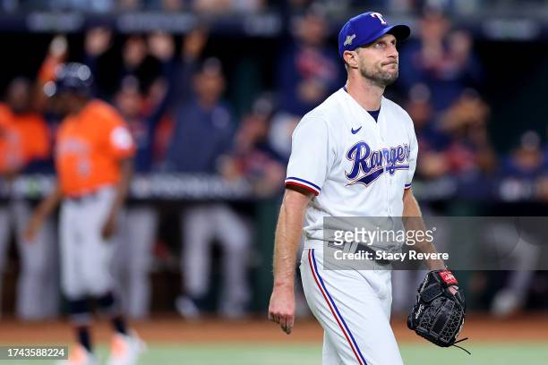 Max Scherzer of the Texas Rangers reacts after giving up an RBI single to Mauricio Dubon of the Houston Astros during the fourth inning in Game Three...