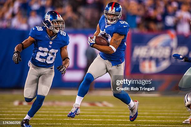 Linebacker Michael Boley of the New York Giants runs the ball after an interception during the game against the Dallas Cowboys at MetLife Stadium on...