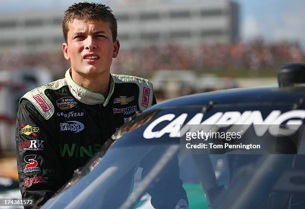 Dakoda Armstrong, driver of the Winfield Chevrolet, looks on during qualifying for the NASCAR Camping World Truck Series inaugural Mudsummer Classic...