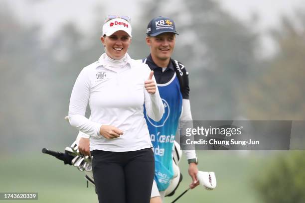 Nanna Koerstz Madsen of Denmark reacts after sinking her putt for eagle on the second green during the first round of the BMW Ladies Championship on...