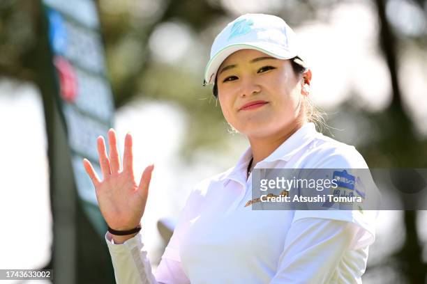 Shiho Kuwaki of Japan waves on the 15th hole during the first round of NOBUTA Group Masters GC Ladies at Masters Golf Club on October 19, 2023 in...