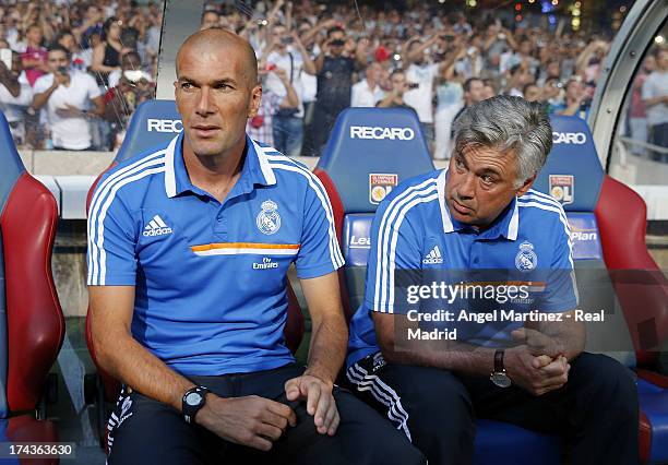 Head coach Carlo Ancelotti and assistant coach Zinedine Zidane of Real Madrid look on during the pre-season friendly match between Olympique Lyonnais...