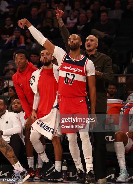 Taj Gibson of the Washington Wizards celebrates his three point shot in the second half against the New York Knicks during a preseason game at...