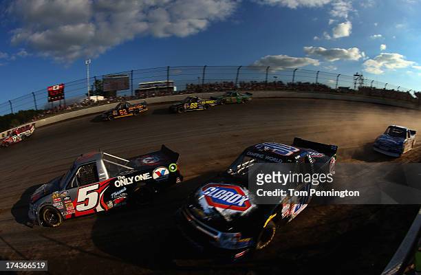 Jason Bowles, driver of the Valvoline Chevrolet, and Kyle Larson, driver of the Clorox Chevrolet, battle for position during a qualifying race for...
