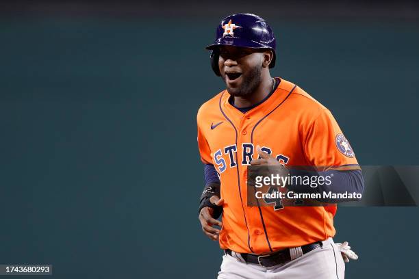 Yordan Alvarez of the Houston Astros celebrates after hitting a two run RBI single against Will Smith of the Texas Rangers during the seventh inning...