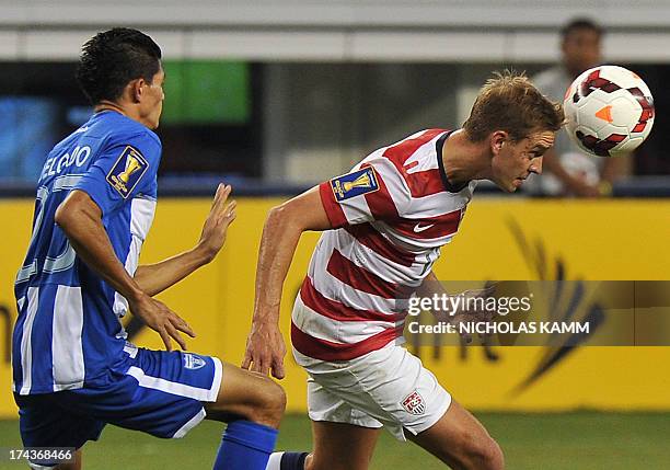 Stuart Holden of the US vies with Edder Delgado of Honduras during a Gold Cup semifinal at Cowboys Stadium in Arlington, Texas, on July 24, 2013. The...