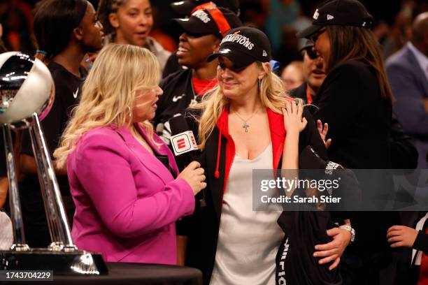 Head coach Becky Hammon of the Las Vegas Aces speaks with Holly Rowe after defeating the New York Liberty during Game Four of the 2023 WNBA Finals at...