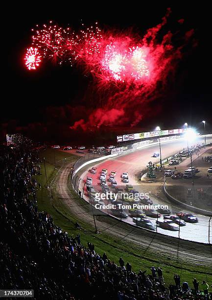 Ken Schrader, driver of the Federated Auto Parts Toyota, leads the field as they line up four wide during the NASCAR Camping World Truck Series...
