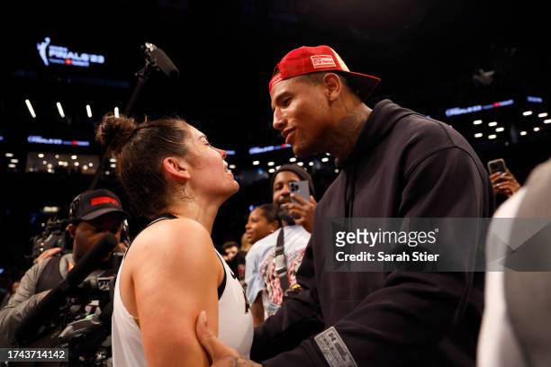 Kelsey Plum of the Las Vegas Aces reacts with husband Darren Waller after defeating the New York Liberty during Game Four of the 2023 WNBA Finals at...