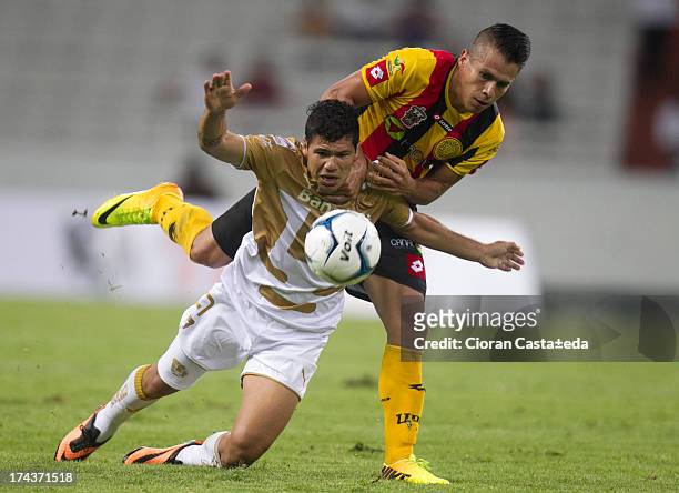 Robin Ramirez of Pumas competes for the ball with Marcelo Alatorre of Leones Negros during a match between Leones Negros and Pumas, as part of the...