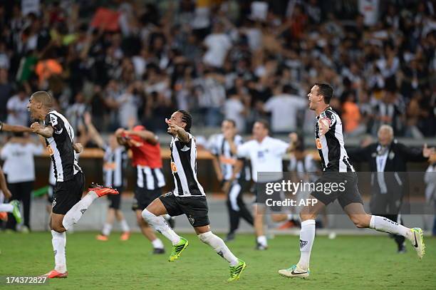 Brazilian Atletico Mineiro's players celebrate after winning their Libertadores Cup second leg final football match against Paraguayan Olimpia in a...