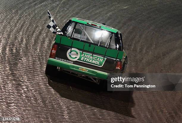 Austin Dillon, driver of the American Ethanol Chevrolet, celebrates after winning the NASCAR Camping World Truck Series inaugural Mudsummer Classic...