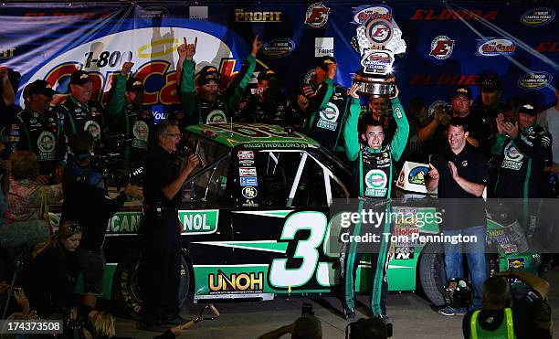 Austin Dillon, driver of the American Ethanol Chevrolet, celebrates in victory lane after winning the NASCAR Camping World Truck Series inaugural...