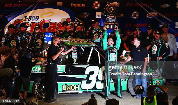 Austin Dillon, driver of the American Ethanol Chevrolet, celebrates in victory lane after winning the NASCAR Camping World Truck Series inaugural...