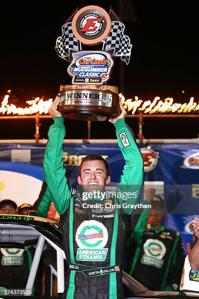 Austin Dillon, driver of the American Ethanol Chevrolet, celebrates after winning the NASCAR Camping World Truck Series inaugural CarCash Mudsummer...