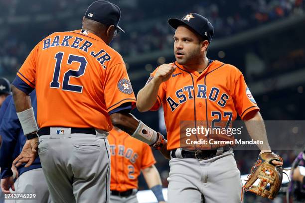 Jose Altuve of the Houston Astros celebrates with manager Dusty Baker after defeating the Texas Rangers in Game Three of the American League...