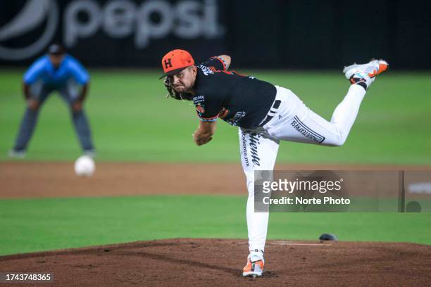Alejandro Cruz, starting pitcher of Naranjeros de Hermosillo, pitches in the first inning during a match between Naranjeros de Hermosillo and Cañeros...