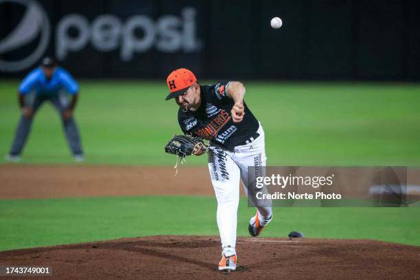 Alejandro Cruz, starting pitcher of Naranjeros de Hermosillo, pitches in the first inning during a match between Naranjeros de Hermosillo and Cañeros...