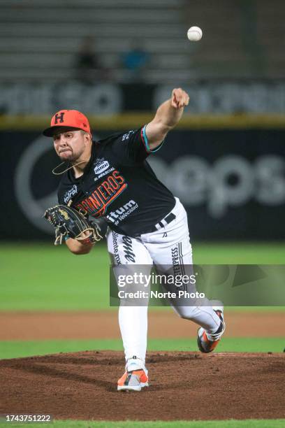 Alejandro Cruz, starting pitcher of Naranjeros de Hermosillo, pitches in the first inning during a match between Naranjeros de Hermosillo and Cañeros...