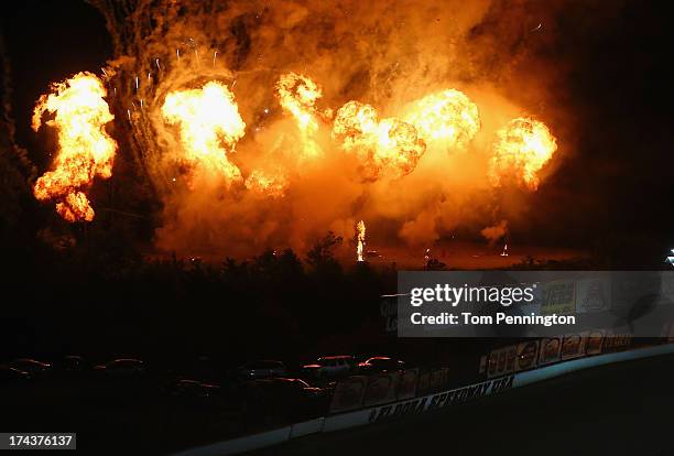 Planned pyrotechnic display explodes during the start of the NASCAR Camping World Truck Series inaugural Mudsummer Classic at Eldora Speedway on July...