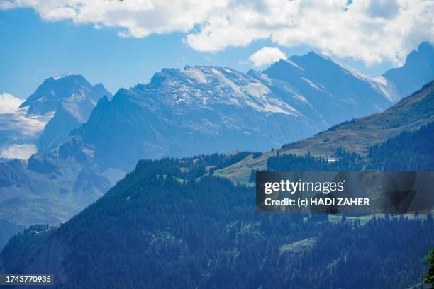 a summer view of the jungfraujoch above lauterbrunnen valley in the swiss alps - monch stock pictures, royalty-free photos & images