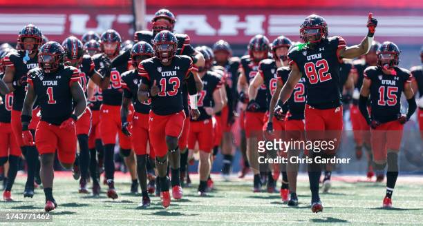Jaylon Glover, Nate Johnson, and Landen King of the Utah Utes lead the team on to the field before their game against the California Golden Bears at...