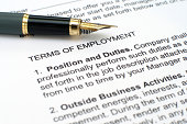 Close up of employment contract and pen