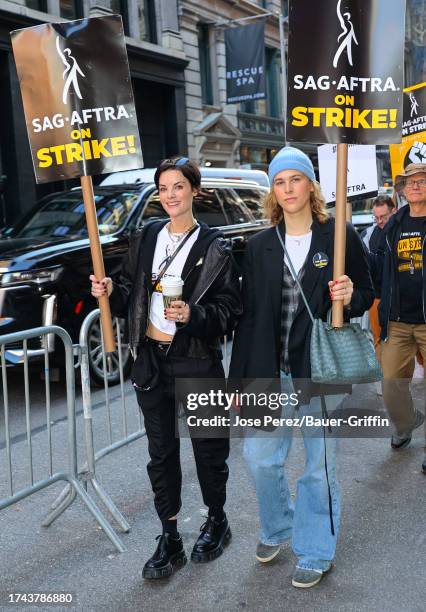 Jaimie Alexander and Tommy Dorfman are seen on the SAG-AFTRA picket line on October 24, 2023 in New York City.
