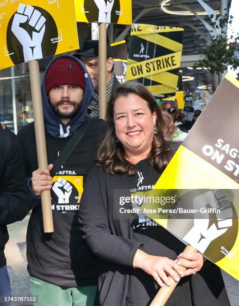 Dylan O'Brien and Rebecca Damon are seen on the SAG-AFTRA picket line on October 24, 2023 in New York City.