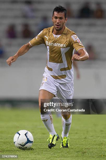 Carlos Luis Garcia of Pumas drives the ball during a match between Leones Negros and Pumas, as part of the Cup MX at Jalisco Stadium on July 24, 2013...