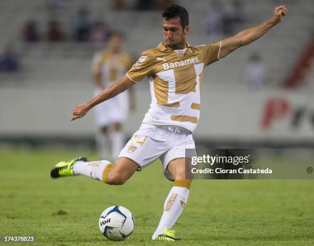 Carlos Luis Garcia of Pumas drives the ball during a match between Leones Negros and Pumas, as part of the Cup MX at Jalisco Stadium on July 24, 2013...