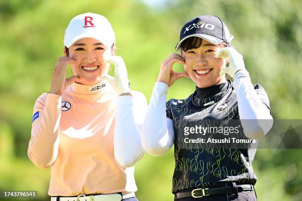 Mone Inami and Nana Suganuma of Japan pose on the 8th hole during the first round of NOBUTA Group Masters GC Ladies at Masters Golf Club on October...