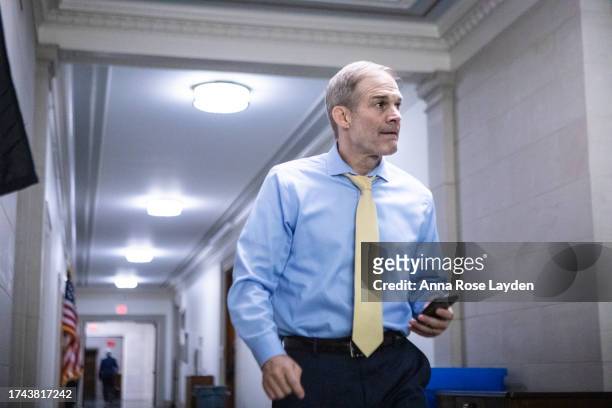 Rep. Jim Jordan walks through the Longworth House Office Building after the Republican conference voted to nominate Rep. Mike Johnson to be Speaker...