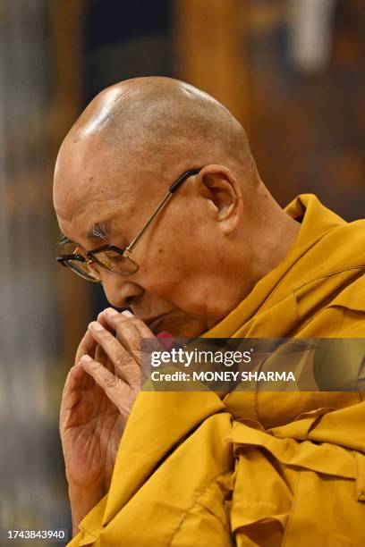 Tibetan spiritual leader Dalai Lama attends a long life prayer offered to him by his students and devotees at his temple in McLeod Ganj, some 10 Km...