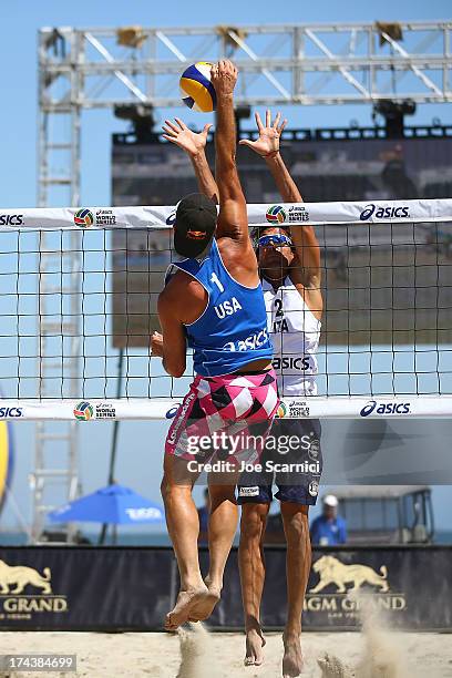 Todd Rogers of USA spikes the ball over Paolo Ficosecco of Italy during the round of pool play at the ASICS World Series of Beach Volleyball - Day 3...