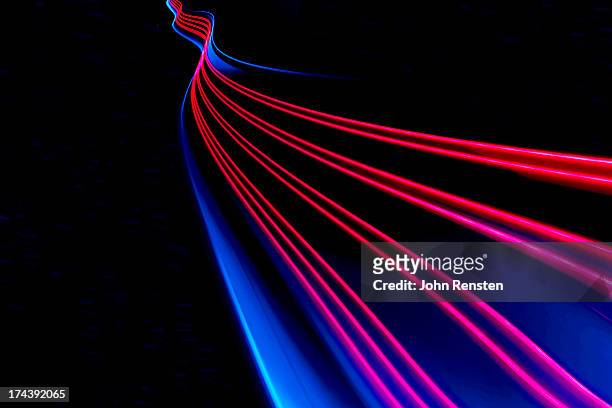 abstract light and heat trails - lange sluitertijd stockfoto's en -beelden