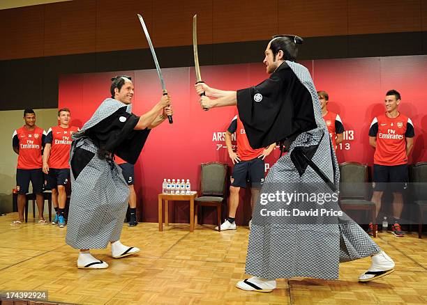 Lukas Podolski and Per Mertesacker of Arsenal FC pose dressed as Samurai Warriors as they put on a demostration for the Arsenal Fans Party in the...