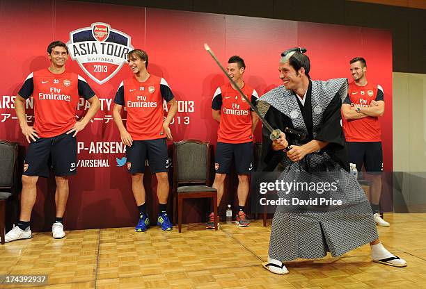 Lukas Podolski of Arsenal FC poses dressed as a Samurai Warrior as he puts on a demostration for the Arsenal Fans Party in the Urawa Royal Pines...