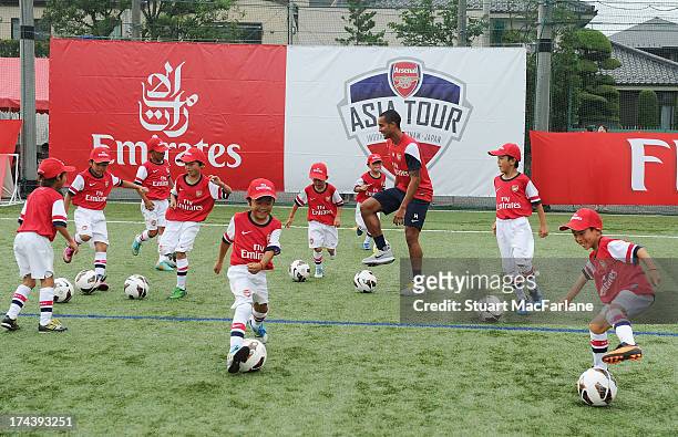 Arsenal's Theo Walcott attends an Emirates Soccer Clinic in Saitama during the club's pre-season Asian tour on July 25, 2013 in Saitama, Japan.